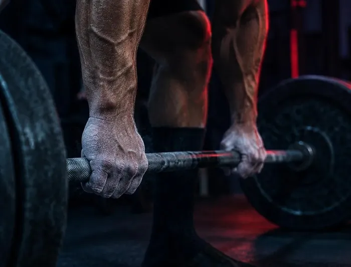 Athlete training with a loaded barbell